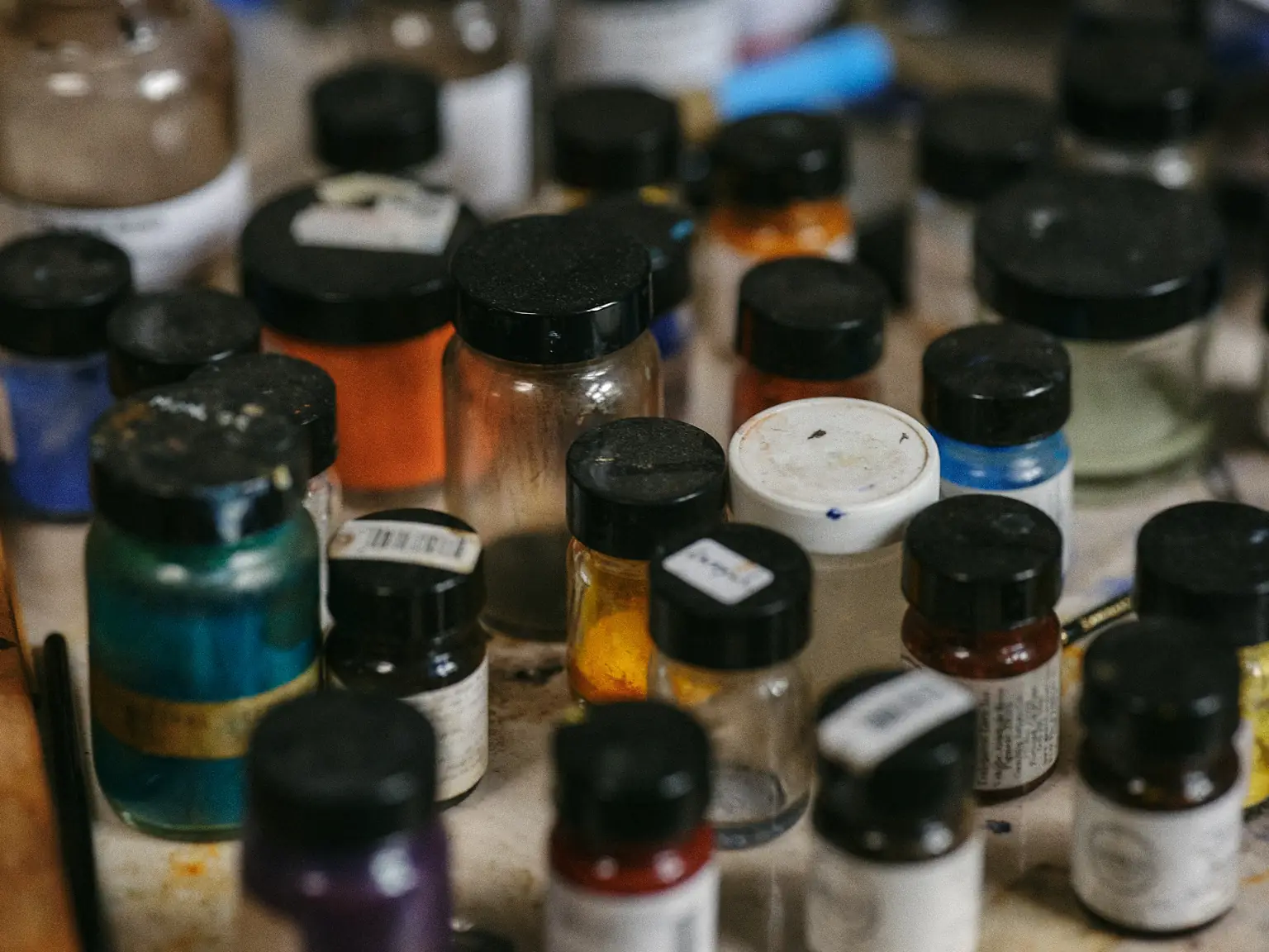 A photo of jars containing pigments.